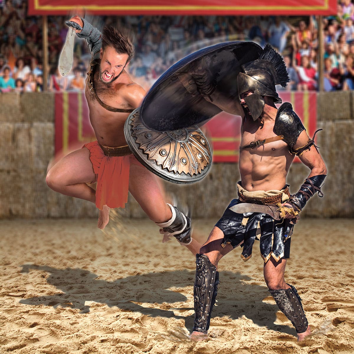 Two gladiators intensely battling in front of an audience