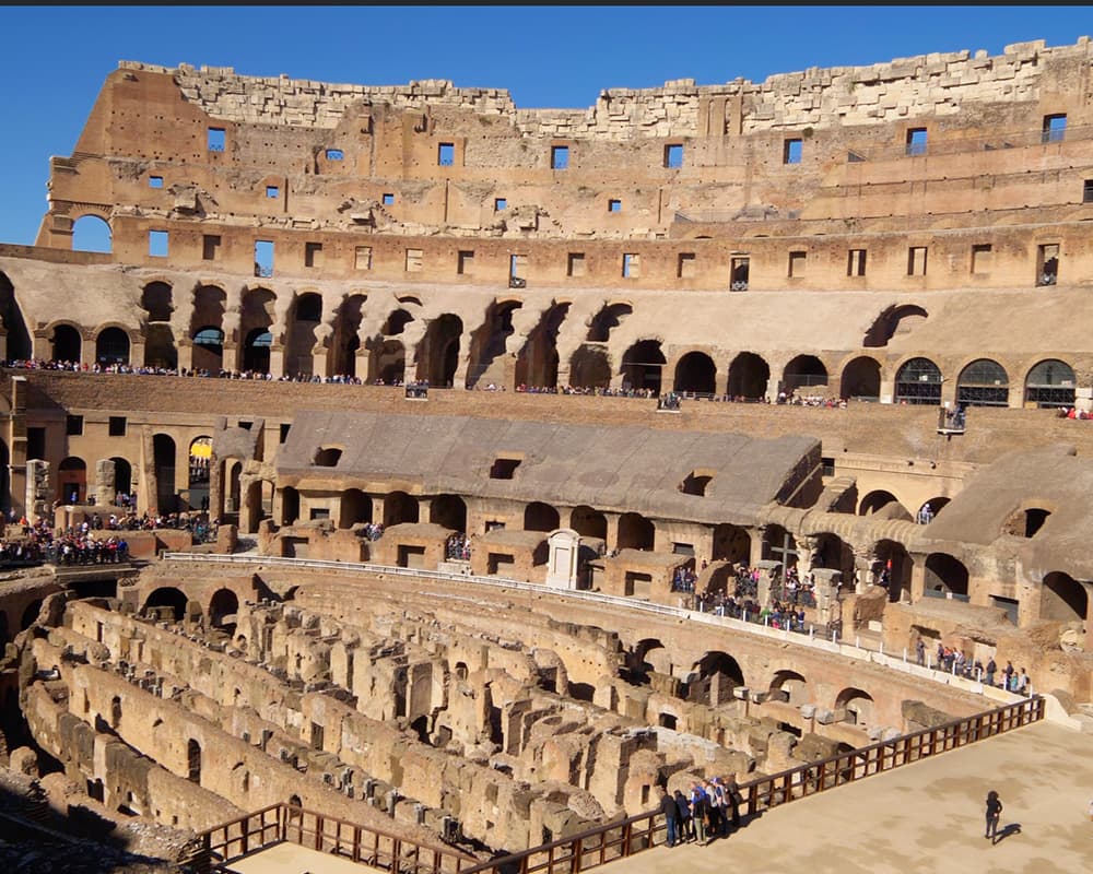 Tourist walking through the remains of the large arena