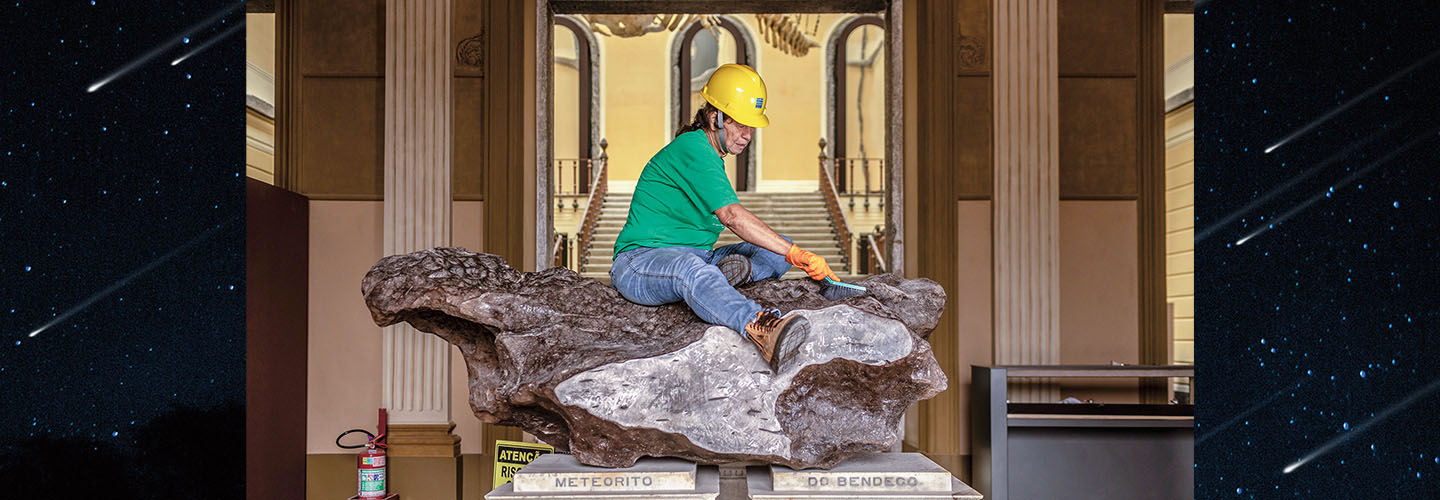 Image of a person sitting on top of a rock